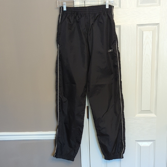Reebok Pants - 90s/Y2K Reebok Women's Black Swishy Winderbraker Pants with White Pinstripe